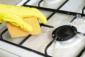Ilustración de Cómo Limpiar los Quemadores de la Cocina
